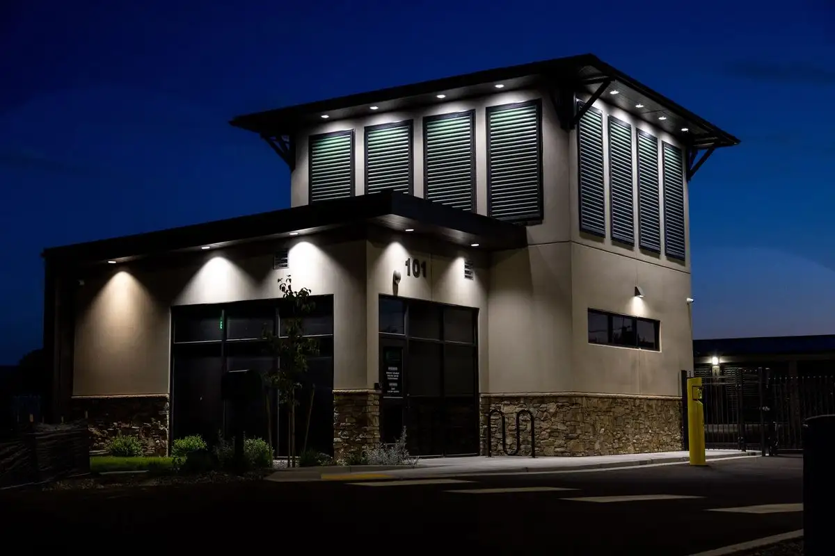 Storage Station office building exterior at night with façade lighting