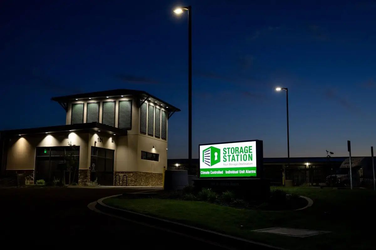 Storage Station office and illuminated monument sign at night