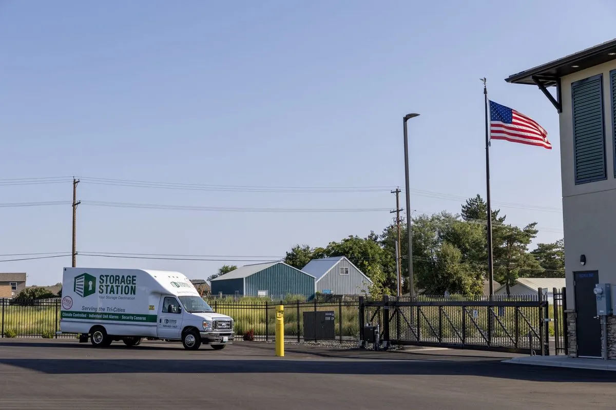 Storage Station moving truck beside the facility building