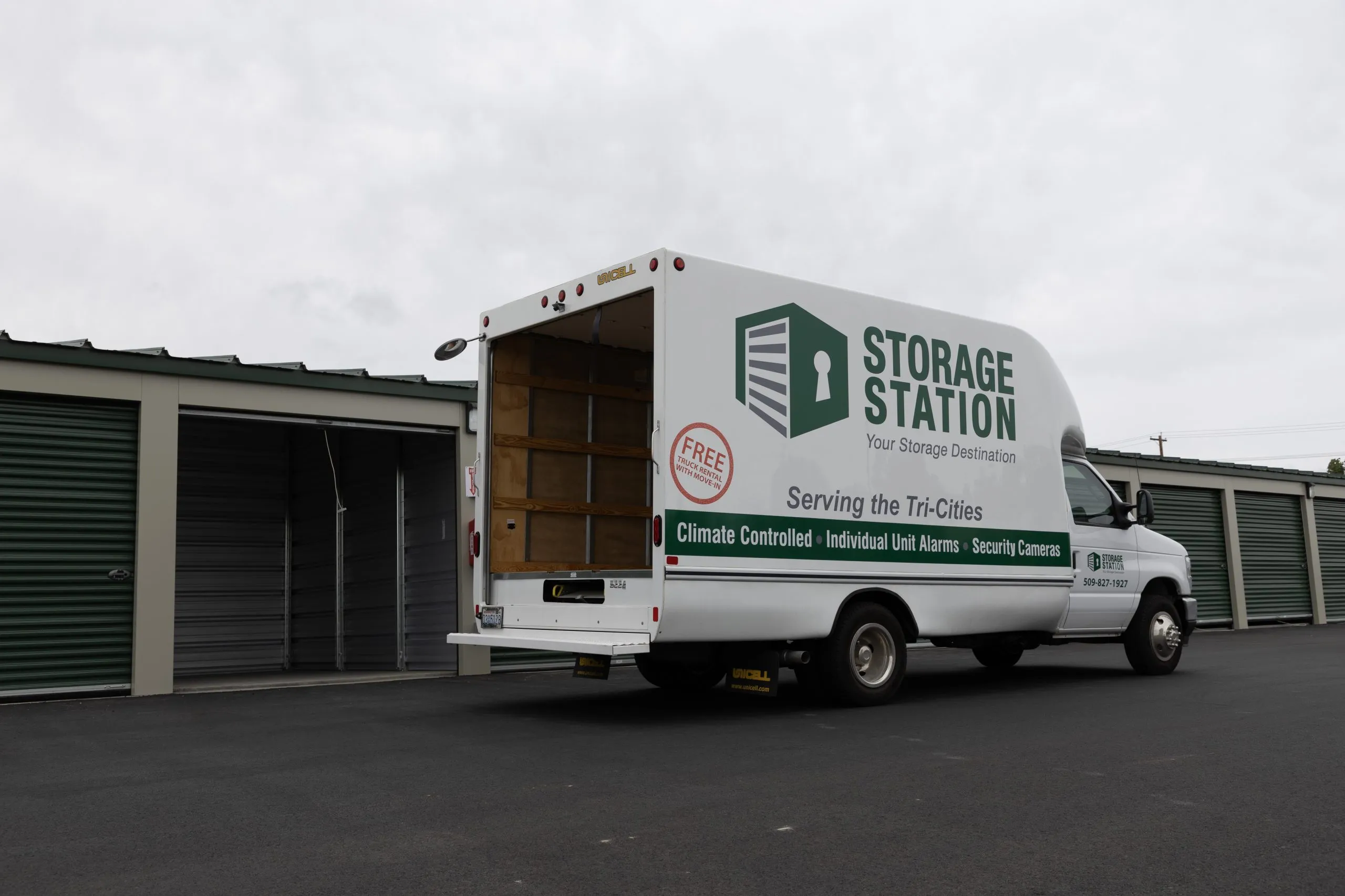 Storage Station moving truck with cargo door open, showing interior